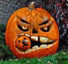 a carved pumpkin with an evil face on it