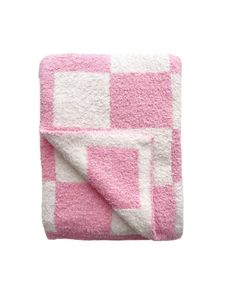 a pink and white checkered blanket on a white background