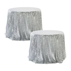 two silver sequin tablecloths on top of each other