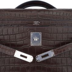 Guaranteed authentic Hermes coveted Kelly Depeches 36 briefcase bag featured in Matte Havane Porosus Crocodile.Laptop compartment and a rear interior wall zip pocket.Accentuated with Palladium hardware.Comes with sleeper and signature Hermes box.NEW or NEVER WORN.final saleBRIEFCASE MEASURES:LENGTH 36.6 cm / 14.4"TALL 29 cm / 11.41"DEEP 5 cm / 1.97"CONDITION:NEW or NEVER WORN TIDS 'n BITSThis new Kelly Depeches documents holder has sleek clean lines with beveled corners harkens to the constructi Luxury Office Briefcase With Palladium Hardware, Luxury Briefcase With Top Handle For Business Trips, Luxury Formal Briefcase With Top Carry Handle, Classic Rectangular Briefcase With Silver-tone Hardware, Classic Bag With Silver-tone Hardware For Business Trips, Designer Formal Briefcase With Silver-tone Hardware, Designer Briefcase With Silver-tone Hardware For Formal Use, Classic Everyday Luxury Bag With Rectangular Case, High-end Business Bag With Crocodile Pattern