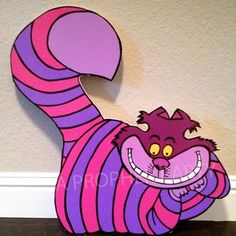 a paper cut out of a cat with purple and pink stripes on it's body