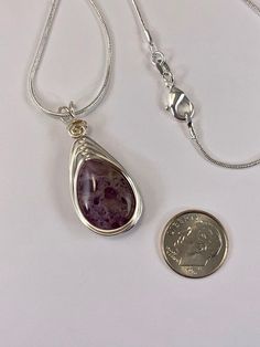 This beautiful natural amethyst necklace is simple yet elegant. The silver wire wrapped design enhances the natural beauty of the smooth polished stone without over powering it. I simply love this gemstone for its natural beauty. Your necklace comes with a sleek 1mm sterling Silver plated chain in your choice of length. Pair this flattering necklace with your favorite dress or a pair of jeans, the possibilities are endless. Amethyst is also the birthstone for February, making this a great gift. Natural Stone Necklace, Natural Stones Necklace, Birthstone Gifts, February Birthstone, Amethyst Necklace, Amethyst Pendant, February Birth Stone, Pendant Silver, Favorite Dress