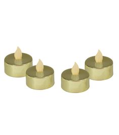 three small candles are sitting on a white surface