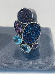 Druzy ring in sterling with blue topaz, amethyst and quartz. One of a kind and a beautiful piece of jewelry. Blue Multi-stone Fusion Gemstones, Unique Multi-stone Blue Rings, Unique Blue Multi-stone Topaz Ring, Blue Amethyst Ring With Accent Stones In Sterling Silver, Blue Amethyst Multi-stone Jewelry, Unique Amethyst Multi-stone Rings, Blue Multi-stone Amethyst Ring As Gift, Unique Multi-stone Amethyst Ring, Unique Multi-stone Blue Topaz Ring