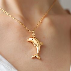 14k Gold Dolphin Fish Pendant, Gold Dolphin Fish Pendant, Dainty Gold Fish Pendant, Animal Fish Pendant, Designer Fish Pendant 🌺Item Details🌺 Item Name : Dolphin Fish ( Only Pendant ) Metal : 925 Silver Size : 30MM Eye Stone : Black Spenel                                        🌊 *About Us: Natural World Jewelry* 🐚 At Natural World Jewelry, we're passionate about bringing the serene beauty of the ocean to your everyday life. Our artisanal jewelry pieces are lovingly handcrafted using a diver Silver Fish Jewellery, Luxury Yellow Gold Fish-shaped Necklace, Fish Locket In Gold, Fish Earrings Gold, Gold Pendent Designs, Fish Pendant Gold, Gold Fish Necklace, Emerald Stone Rings, Dolphin Fish