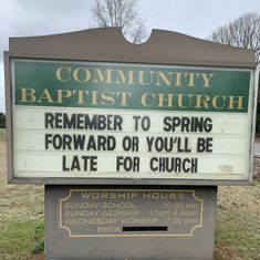 a sign in front of a church that says, community baptist church remember to spring forward or you'll be late for church