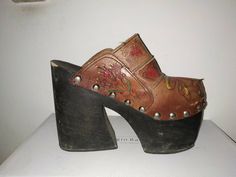 "NOT FOR SALE DO NOT PURCHASE Too good not to share... Super Rare & Amazing Vintage 1970s Leather Platforms Clogs - Hand Carved/Tooled. LOVE ROCKS VINTAGE ITEM DETAILS & DESCRIPTION . Leather Upper - Hand Carved/Tooled . Slip on . Wood Base & Heel . Studs Label: N/A Size: estimate to fit a size 6 - NO RETURNS FOR NOT FITTING! Era: 1970s Color: refer to Photographs Material: Leather Upper Condition: Vintage - Very Good - expect Vintage Wear & Condition - Previously Owned & Wor Vintage Closed Toe Mules With Wooden Heel, Spring Vintage High Heel Clogs, Vintage High Heel Platform Clogs, Vintage Brown High Heel Mules, Vintage Wooden Heel Closed Toe Clogs, Vintage Clogs With Wooden Heel And Closed Toe, Vintage Closed Toe Clogs With Wooden Heel, Vintage Brown High Heel Clogs, Vintage Platform Clogs For Spring