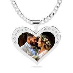 This Heart portrait pendant with stones is the perfect gift for that special someone. One subject can be taken from a photo and engraved in spectra color onto the finished piece making it a colored heirloom to treasure. Available in sterling silver and 14K over sterling silver. Measures: 1.25" x 1". Get Yours Today! *The coating process we use on the photo pendant may slightly darken the photo. Personalized White Diamond Jewelry Gift, Personalized White Gold Jewelry With Diamond Accents, Personalized Silver Jewelry With Diamond Accents, Customizable Pendant Necklace For Anniversary, Customizable Pendant Necklaces For Anniversary, Personalized White Gold Diamond Jewelry, Heart Cut Locket For Anniversary Gift, Diamond Heart Pendant Jewelry Gift, Diamond Heart Pendant Jewelry For Gift