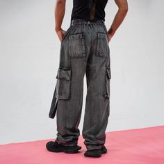 The Heavily Ripped Stripe Denim Cargo pants bring a bold and rugged edge to any wardrobe, combining avant-garde style with impeccable craftsmanship. Featuring a washed and distressed finish, these cargos are adorned with heavy ripping and tear details on the front for a striking, worn-in look. Satin stripes run down each side, adding a unique contrast to the denim. With a multi-pocket design, these pants are both functional and stylish. Made from premium 100% cotton fabric, they offer a slightly Sneakers And Socks, Denim Cargo Pants, Denim Cargo, Half Shirts, Jean Accessories, Avant Garde Fashion, Pocket Design, Jeans Pants, Short Pants