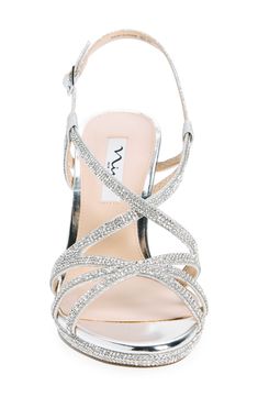 Sparkling rhinestones add eye-catching glamour to a slingback sandal set on a subtle platform and tapered heel. Adjustable slingback strap with buckle closure Synthetic upper and lining/leather sole Imported Rhinestone Sandals Flats, Silver Sandals Heels, Heels Silver, Fashion Shoes Flats, Silver Sandals, Silver Heels, Open Toe Sandals, Toe Sandals, Slingback Sandal