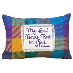 a colorful plaid pillow that says, my soul finds rest in god