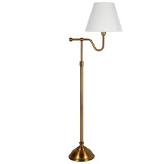 a brass floor lamp with a white shade