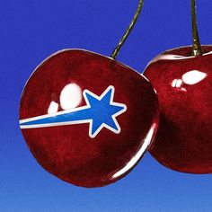 two cherries with blue and white stars on them