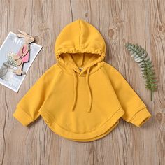 Unisex Solid Color Long Sleeve Hooded Cloak Style Top Trendy Kids Wholesale Clothing - PrettyKid Cotton Hoodie With Adjustable Hood For Playtime, Cotton Hoodie For Playtime In Fall, Playtime Hoodie With Adjustable Hood, Adjustable Hood Hoodie For Playtime In Fall, Winter Long Sleeve Hoodie For Playtime, Long Sleeve Hoodie For Winter Playtime, Cotton Hooded Hoodie For Playtime, Casual Hooded Hoodie For Playtime, Winter Hooded Hoodie For Playtime