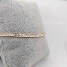 A stunning natural diamond tennis bracelet in 14k yellow gold. This classic design never goes out of style, make your statement with this string of sparkling diamonds, a perfect gift for yourself or someone you love. This bracelet has a secure clasp for worry free wear! Yellow Gold Cubic Zirconia Tennis Bracelet For Everyday Luxury, Yellow Gold Tennis Bracelet With Cubic Zirconia Round Cut, Yellow Gold Cubic Zirconia Tennis Bracelet With Round Cut, Yellow Gold Tennis Bracelet With Cubic Zirconia, Yellow Gold Cubic Zirconia Tennis Bracelet, Gold Diamond Tennis Bracelet With Round Cut, Dazzling Yellow Gold Tennis Bracelet As Gift, Dazzling Yellow Gold Tennis Bracelet Gift, Round Cut Gold Diamond Tennis Bracelet