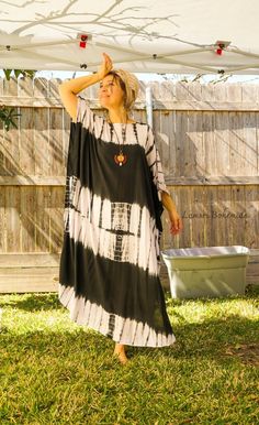 "Add a touch of unique style to your wardrobe with our Hand-Dyed Kaftan Dress! This stunning dress is made from 100% breathable and comfy rayon fabric, ensuring maximum comfort all day long. Using our unique method, each dress is carefully hand dyed, resulting in a one-of-a- kind masterpiece. The intricate patterns and vibrant colors make this dress a true work of art. The kaftan dress comes in a versatile one size fits most (M-3XL), making it extremely comfortable for a wide range of body types. With a bust measurement of up to 60\", you can feel confident that this dress will flatter your figure. The dress measures 55\" in length and 45\" in width, providing a loose and flowing fit that is both stylish and flattering. Featuring a trendy V-neck design and side slits, this slipover style d Hand Dyed Bohemian Maxi Dress, Bohemian Flowy Hand-dyed Maxi Dress, Bohemian Flowy Hand Dyed Maxi Dress, Oversized Bohemian Maxi Dress With Batwing Sleeves, Bohemian Maxi Dress With Batwing Sleeves For Summer, Casual Oversized Maxi Dress For Festival, Oversized Casual Maxi Dress For Festival, Casual Flowy Tie-dye Kaftan, Casual Hand Dyed Kaftan For Summer