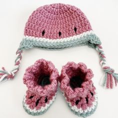 a crocheted hat and pair of baby shoes