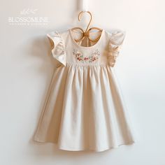 Delicate spring and summer linen dress for girl, hand embroidered dress with floral design. Ideal for a special occasion or to enjoy it at any time of the day. Baby dress and children's dress made of soft and fresh fabric for Spring Summer, cream-colored linen with embroidery in pure cotton thread in neutral tones. Emma dress, represents our Blossom collection of hand-embroidered linen dresses in different colors. Flower designs with simple lines represent nature thus creating unique and very special garments. The dresses are made of linen and cotton fabric. Dresses with ruffles on the sleeves and a wide skirt. On its front it has a floral design embroidered by hand with pure cotton threads. For this collection we select pastel colors, soft tones combined to perfection. We design garments Hand Embroidered Dress, Girl Hand, Summer Linen Dresses, Dress For Spring, Childrens Dress, Dress Cream, Summer Linen, Embroidered Linen, Dress Floral