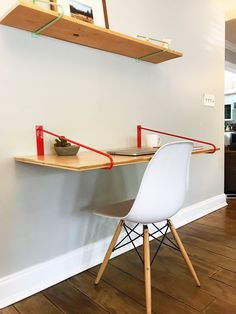 a white chair sitting next to a wooden table