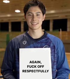 a young man holding a sign that says, again f k off respectfully