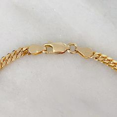 This finely handcrafted Cuban link chain necklace is entirely composed 14K solid gold which is finished with a lobster claw clasp. The links to this particular chain are completely solid. NOTE: This item is available in longer or shorter length options and can be customized to fit your own personal diamond. Kindly email us for pricing and details. Total Length: available in your choice of 14, 16, 18, 20, 22, 24, 26, or 30 inches Link Dimensions: approximately 3.2mm (W) x 4mm (L) x 1.5mm thick To Gold Cuban Link Chain, Miami Cuban Link Chain, Miami Cuban Link, Cuban Link Chain Necklaces, Miami Cuban, Jewellery Designer, Link Chain Necklace, Handcrafted Necklace, Layering Necklace