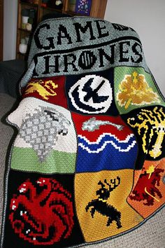 a crocheted blanket with the words game of thrones on it