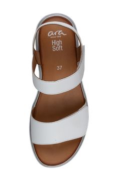 A lightweight platform wedge elevates this sporty sandal featuring a cushy, arch-supporting footbed and wide, adjustable leather straps for all-day comfort. Flat sole Removable, cushioned insole with arch support Leather upper and lining/synthetic sole Imported White Sporty Sandals With Arch Support, Modern White Sandals With Ortholite Insole, White Leather Wedge Sandals With Arch Support, White Synthetic Wedge Sandals With Arch Support, Comfortable White Leather Wedge Sandals, Comfortable White Wedge Sandals With Arch Support, White Sport Sandals With Leather Footbed, Casual White Sandals With Gel Cushioning, White Casual Wedge Sandals With Arch Support