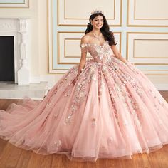 Wow your guests in this stunning Quinceañera gown. Crafted from dreamy glitter tulle, this breathtaking ballgown features sparkling stone accents, shimmering beadwork, and enchanting three-dimensional flowers. The elegant sweetheart neckline and basque waistline are ultra-flattering, while the stunning floral design on the tulle skirt makes a statement that's as unique and unforgettable as you are. Want to switch up your Quinceañera style? Get party ready in an instant by simply removing the sep Aurora Quince, Cotillion Dresses, Pink Quinceanera, Kids Pageant, Quinceañera Ideas, Pink Quince, Quinceanera Photography, Quinceanera Dresses Pink, Pink Ball Gown