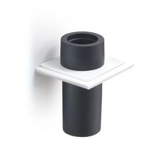 a black and white toilet paper holder on the wall