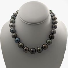 This necklace is absolutely stunning. Words can barely do it justice, but let me attempt to capture its essence. A magnificent treasure ready to be cherished for generations, this Tahitian pearl necklace represents the pinnacle of luxury and elegance. Expertly chosen pearls, arranged and artfully strung together to create a breathtaking masterpiece. Meticulously crafted, the necklace combines the rare glamour of Tahitian pearls with the rhodium-plated 14K yellow gold filigree ball clasp and tire Luxury Tahitian Pearl Round Bead Necklace, Tahitian Pearl Round Beads Formal Necklace, Formal Tahitian Pearl Necklaces With Round Beads, Formal Single Strand Tahitian Pearl Necklace, Formal Tahitian Pearl Round Bead Necklaces, Luxury Tahitian Pearl Necklace For Formal Occasions, Luxury Single Strand Tahitian Pearl Necklace, Luxury Tahitian Pearl Single Strand Necklace, Elegant Tahitian Pearl Necklace For Formal Occasions