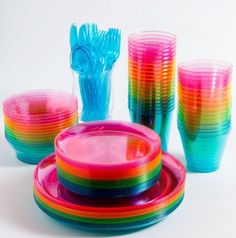 a set of colorful plates and cups with toothbrushes