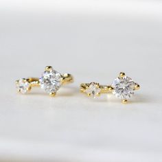 Beautiful, High Quality Drop Stud Earrings Featuring Two Cubic Zirconia Stones - One Round Stone And One Square Stone. Sophisticated Earrings To Add Glam To Your Look! Available In Gold Or Silver Sterling Silver With 14k Gold Plating Highest Quality Cubic Zirconia Stones This Item Is Plated To Resist Against Tarnishing. Over Time, Plated Jewelry May Tarnish And To Prevent This, We Recommend Avoiding Exposure To Water, Sweat, Etc To Ensure The Longevity Of The Piece Ships Either Same Or Next Day Silver Cubic Zirconia Ear Cuff For Anniversary, Anniversary Silver Cubic Zirconia Ear Cuff, Cubic Zirconia Single Ear Climber For Wedding, Wedding Cubic Zirconia Drop Ear Climbers, Single Cubic Zirconia Bridal Earring For Anniversary, Anniversary Cubic Zirconia Single Ear Cuff, Anniversary Single Crystal Earring, Cubic Zirconia Ear Cuff With Prong Setting For Anniversary, Diamond Ear Cuff For Pierced Ears Gift