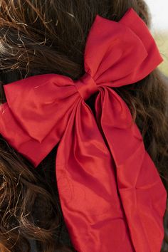 Elevate your hairstyles with our Charmed Bow! The large silky bow adds a touch of charm to any hairdo, transforming it into a statement piece. Get ready to turn heads and feel confident with this versatile accessory. Perfect for adding a touch of elegance to any outfit. Charmed Bow-Red, boutique clothing, casual, the perfect bow! Boutique Clothing Chic Bow Hair Accessories For Party, Chic Party Hair Accessories With Bow, Chic Formal Hair Accessories With Satin Bow, Elegant Satin Bow Headband, Chic Ribbon Hair Accessories For Party, Formal Bow Headband, Chic Party Hair Accessories With Ribbon, Chic Party Hair Accessories With Satin Bow, Chic Satin Bow With Ribbon Details