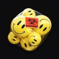 a bunch of yellow smiley faces in a bag with a red sticker that says biohazard