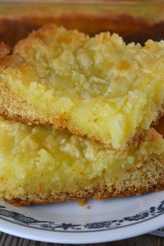 two pieces of cake sitting on top of a blue and white plate next to each other