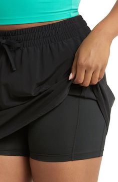 A high-waist skort with an elastic waistband and built-in shorts keeps you moving securely and comfortably through every workout. 15 1/2" front length; 4" inseam; 18" leg opening (size Medium) Lined 86% polyester, 14% elastane Machine wash, tumble dry Imported 4-way Stretch Tennis Skirt With Built-in Shorts For Workout, Tennis Skirt With Built-in Shorts For Workout, Stretch Go-dry Skort For Gym, Versatile Stretch Skort For Workout, Gym Skort With Go-dry 4-way Stretch, Go-dry 4-way Stretch Gym Skort, Athleisure Stretch Skort For Gym, Athleisure Stretch Skort For Workout, Functional Stretch Skort For Workout