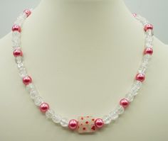 "17\" pink and crackled white beaded necklace/choker Glass beads with Lampworked Glass flower bead accent      Shiny pink glass beads      Crackled clear/white glass beads      Pink and white flowers are on the center bead          The necklace clasp is an \"easy to open and close by yourself\" toggle clasp Ships next business day!" White Beaded Necklace, Pink Choker, White Beaded Necklaces, Necklace Clasps, Pink And White Flowers, Pink Necklace, Necklace White, Band Bracelet, Black Necklace