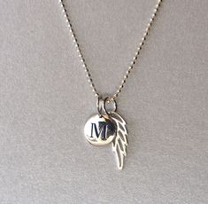 "our initial charm necklace is the perfect personalized gift for your loved one. MATERIAL * sterling silver engraved disk and silver metal chain DETAILS * length: 16\" or 18\" * initial (mm): 12 x 8 diameter * wing (mm): 15 x 6 * chain: sterling silver diamond-cut ball chain or cable chain * closure: sterling silver spring ring * item comes in a gift box OPTIONS * add an initial: $13.00 * add a birthstone: $6.00, https://www.etsy.com/listing/179762296/add-on-crystal-birthstone-charm?ref=shop_hom Angel Pendant, Gold Initial, Birthstone Charms, Silver Spring, Initial Charm, Ball Chain, Silver Diamonds, Cute Jewelry, Metal Chain