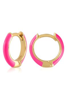 Easy-to-wear hoop earrings will add significant polish to even your most casual ensembles. 1/2" drop; 1/8" width Hinge with snap-post closure Sterling silver with goldtone plate/enamel Imported Trendy Gold Enamel Earrings, Trendy Pink Enamel Earrings, Trendy Hypoallergenic Enamel Earrings, Trendy Gold Enamel Hoop Earrings, Trendy Enamel Earrings For Everyday, Hoop Huggie Earrings In Enamel, Pink Enamel Hoop Jewelry, Trendy Pink Huggie Earrings, Gold Enamel Huggie Earrings As Gift