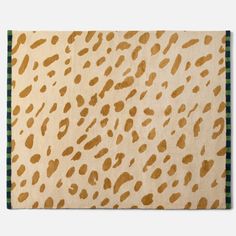 an animal print rug with green and white checkered border on the bottom right corner