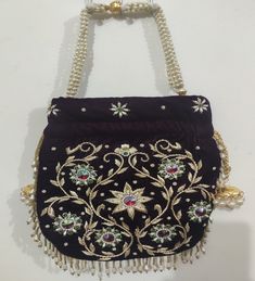 This beautiful Potli or batawa bag are eye catchy and made of premium material. Key Features: Potli Bag Dimension -- 10*8 Inches Embroidery art work This potli is good match with both Indian and western outfits and are superb for wedding and festive parties This would be best complement to your designer saree, lenhga or any other kind of dress This is the combination of traditional and modern embroidery work This is enough to keep your accessories and all needed essentials and it can be a best g Embroidered Rectangular Festive Pouch, Festive Rectangular Embroidered Pouch, Handmade Multicolor Shoulder Bag For Weddings, Traditional Rectangular Pouch For Party, Traditional Handmade Shoulder Bag For Party, Traditional Rectangular Shoulder Bag For Party, Traditional Handheld Potli Bag With Zari Work, Embroidered Rectangular Shoulder Bag For Celebration, Traditional Handheld Potli Bag With Handwork