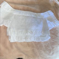 This Is A White And Stretchy Bandeau/Crop Top. Super Cute And Will Compliment Any Outfit. Brand New. White Off-shoulder Summer Top For Vacation, Summer Off-shoulder Fitted Tube Top, Off-shoulder Fitted Tube Top For Vacation, Fitted Off-shoulder Summer Tube Top, White Fitted Off-shoulder Top For Summer, Fitted White Off-shoulder Top For Summer, Bandeau Top With Ruffles For Vacation, White Off-shoulder Top With Ruffles For Day Out, White Ruffled Off-shoulder Top For Day Out