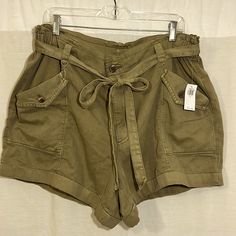 Nwt Old Navy High-Waisted Cargo Shorts, Size Extra-Large. These Shorts Are Super Cute! Somewhere Between A Khaki/Olive/Army Green In Color, They Have Buttoned Front Pockets And A Cinched Waist With A Belt To Tie In Front. Please See Photos For Measurements And Additional Information, And Let Me Know If You Have Any Questions! Happy To Bundle :-) Thank You For Looking! Old Navy Shorts, Navy And Green, Cinched Waist, Cargo Shorts, Army Green, Old Navy, Extra Large, High Waist, Super Cute