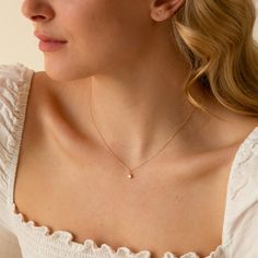 Meet our Diamond Bead Bezel Necklace - it's the perfect delicate diamond necklace with a modern twist. Bring luxury into your everyday life with this dainty necklace. Made of gorgeous 14k gold and a lab-grown diamond, so you can wear it everywhere - from your morning coffee run to girl's night out. Yes - that includes the gym and the shower too! DETAILS 14k solid gold necklace Necklace length: 16" with 2" extender Necklace thickness: 0.9mm Weight: 1.2g Lab-grown diamond: 3mm Diamond carat: 0.1 c Diamond Necklace Aesthetic, Everyday Necklace Simple, Delicate Diamond Necklace, Necklaces Simple, Everyday Necklaces, Baguette Necklace, Classy Necklace, Pearl Anklet, Solid Gold Bracelet