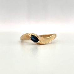 Natural Blue Sapphire set in 14K yellow gold. This is a beautiful blue with a great sparkle in the sunlight. A simple elegant twist look to stack with other rings or worn on it's own. Size 8.5 14K yellow gold Weight: 1.93 grams Blue Marquise cut Sapphire approximately .20ct ***With any pre-owned/Vintage/Antique items, it is common to have some wear, As we inspect each piece of our jewelry, we make sure the wear and tear is acceptable within industry standards*** FOLLOW US TO SEE MORE PHOTOS OF O Marquise Yellow Gold 14k Birthstone Ring, 14k Yellow Gold Marquise Birthstone Ring, Blue Fine Jewelry Stackable Rings For Formal Events, Blue Stackable Rings For Formal Occasions, Formal Blue Fine Jewelry Stackable Rings, Elegant Stackable Blue Topaz Ring, Formal Blue Stackable Rings, Stackable Marquise 14k Gold Rings, Gold Marquise Birthstone Ring In 14k Gold