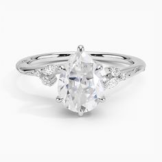 an oval cut engagement ring with side stones