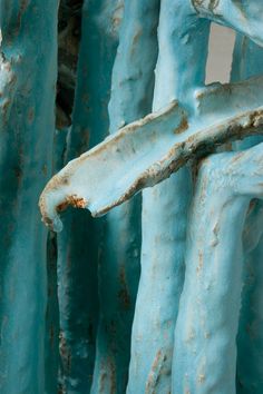 an old rusted metal structure with blue paint