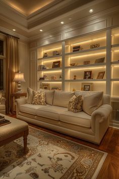 a living room filled with furniture and bookshelves on the wall next to a window