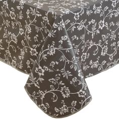 a black and white tablecloth with flowers on the top, in front of a white background