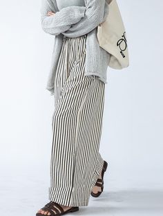 Elevate your ensemble with these high-waisted striped trousers, boasting a loose fit and split-joint accents. Offering both style and comfort, they're a versatile choice for any occasion. Styling Striped Pants, Striped Baggy Wide-leg Pants, Trendy Striped Wide Leg Pants, Striped Trousers For Fall, Casual High Waist Wide Leg Pants For Day Out, Fall Striped High-waisted Pants, Baggy Striped Wide Leg Bottoms, Striped Baggy Wide Leg Bottoms, Casual High Waist Cotton Harem Pants